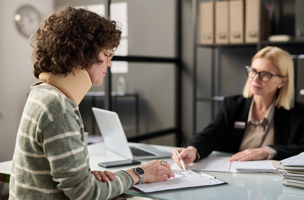 Injured person talking to a workers compensation lawyer