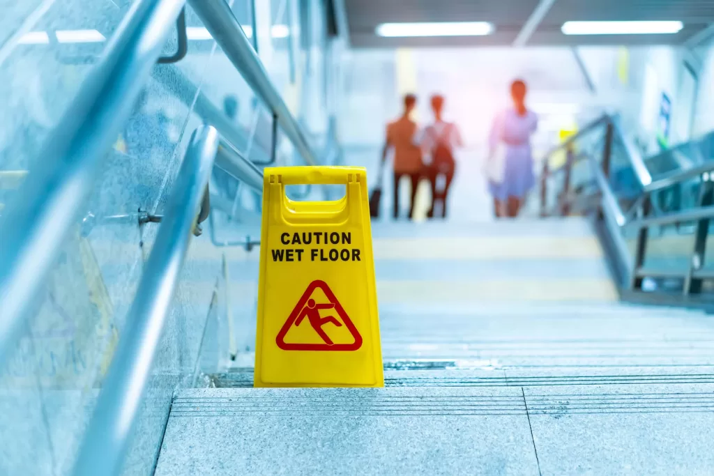 "Caution wet floor" sign in stairs