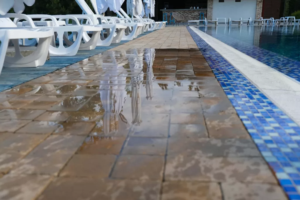 View of the wet floor by the outdoor summer pool.